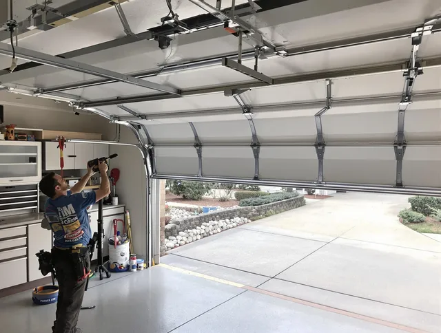 Garage door track repair service by Sandy Springs Garage Door Repair in Sandy Springs
